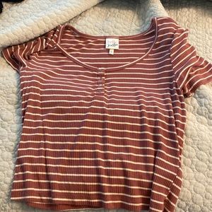 It’s a cute crop top that is belle du jour. it’s white a like a pink color.